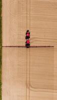 Aerial view of a tractor plowing a field video