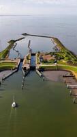 Aerial view of a canal with boats in it video