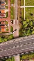 Aerial view of a road with a cemetery in the background video