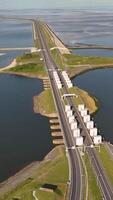 An aerial view of a highway with trucks on it video