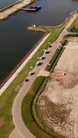 An aerial view of a large body of water and a road video