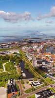 An aerial view of a city with a river and a bridge video