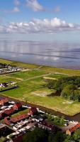 An aerial view of a small town with houses and a beach video