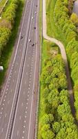 Aerial view of highway with trees and water video