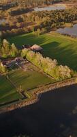 An aerial view of a farm and a lake video