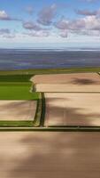 Aerial view of fields and water in the netherlands video