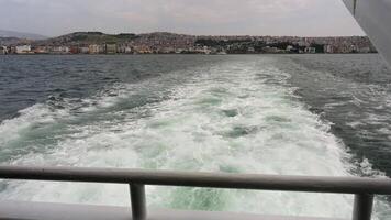 View from the back deck of the boat rising from the foamy waves video