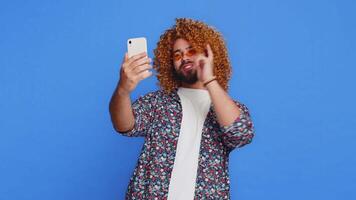 Happy man blogger taking portrait selfie record call online with social media subscribers video
