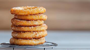 A stack of donuts on a wire rack photo