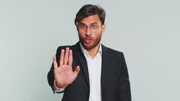 Businessman say no hold palm folded crossed hands in stop gesture warning finish prohibited access video