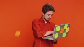 Man with pasted sticker notes use laptop having concentration problem big routine overloading work video