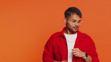Happy Indian man having fun dancing moving to rhythm dabbing raising hands, making dub dance gesture video
