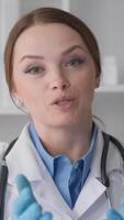 In a clinical setting, a female doctor discusses health topics while wearing gloves and a stethoscope, surrounded by medical files and a soothing plant that enhances the calming atmosphere video