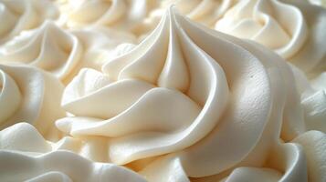 Whipped cream decoration showcasing intricate swirls in a bakery setting during daylight photo