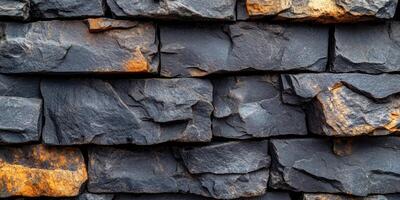 Dark stone masonry with natural textures and warm hues showcased in a well-structured arrangement for architectural design photo