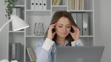 A woman experiences stress working from home due to ongoing computer issues, highlighting the mental fatigue many face during the rise of remote work, impacting concentration and efficiency video