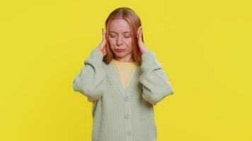 Annoyed irritated woman covering ears gesturing no avoiding advice ignoring noise loud voices video