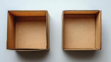Two empty cardboard boxes placed side by side on a white surface showcasing their simple design and structure photo
