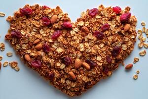 Heart shaped granola on white background. Healthy food, cereals, healthy eating concept photo