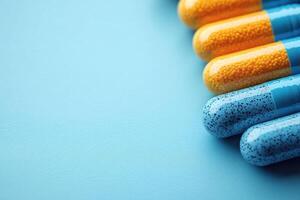 pills on blue background with copy space photo