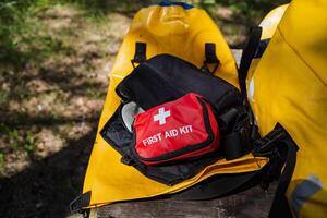 A wellstocked first aid kit is conveniently located in a bright yellow bag, making it easy to identify and access in case of emergency situations where medical assistance is required photo