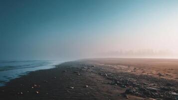Serene Beach Landscape with Misty Horizon and Gentle Waves at Dawn, Capturing Nature's Tranquility and Beauty photo