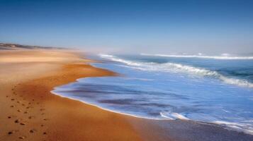 Serene Coastal Landscape with Gentle Waves and Golden Sand under a Vibrant Blue Sky photo