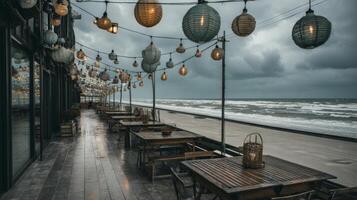 Coastal Restaurant Exterior with Lanterns and Stormy Sky over Ocean Waves on Cloudy Evening photo