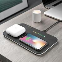 Wireless charger with smartphone and AirPods on wooden desk in modern workspace with soft lighting and copy space photo