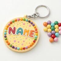 Personalized keychain with design surrounded by colorful beads on a white background with copy space photo