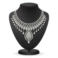 Elegant silver necklace with intricate design displayed on a black bust stand against a white background with copy space photo