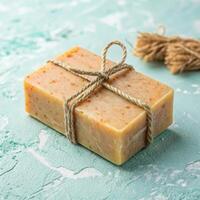 Handmade soap bars with natural ingredients on textured background with organic mood and copy space photo