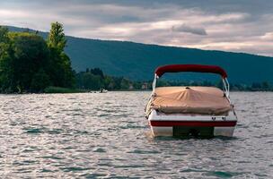 a boat is floating on the water with a cover on it photo