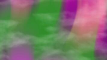 Abstract blur of green, pink, and purple colors, suitable for backgrounds, presentations, web design, and social media graphics. video