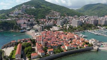 Clear day in Budva with sweeping aerial of Adriatic Sea and ancient architecture video