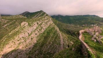 Aerial or ground view from Bar's Stari Grad ruins capturing the dramatic mountain backdrop and historic stone structures. video