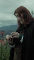 Mysterious Woman Reads An Esoteric Book In The Mountains Among The Trees Outside video