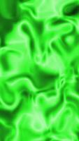 Dynamic flowing light in shades of vivid green creates an abstract rippling pattern video