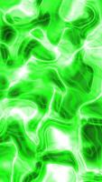 An abstract swirling pattern of bright green shapes with lighter lines and occasional black spots video