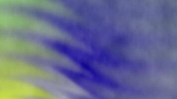 Blurred image with hues of yellow green and blue blending in a diagonal gradient pattern video