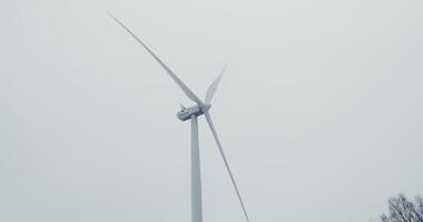 A wind turbine in the fog photo