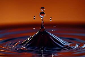 Water droplets falling into a bowl of water photo