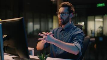 Caucasian business man businessman finish online working overtime end computer job complete task overworked tired employer guy male in night evening office relaxing hands behind head pause relaxing video