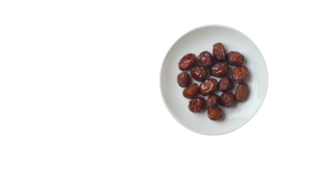 Freshly harvested dates arranged neatly on a white plate in a simple setting png