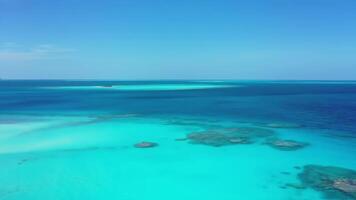 Aerial View of Turquoise Ocean Water and Sandy Beach Coastline video