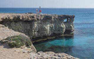 Breathtaking coastal landscape of Cape Ayia Napa, also known as Cape Greco, located on the southeastern coast of Cyprus. Featuring dramatic limestone cliffs photo