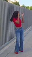 A dynamic dance pose is showcased against a stunning backdrop of modern architecture video