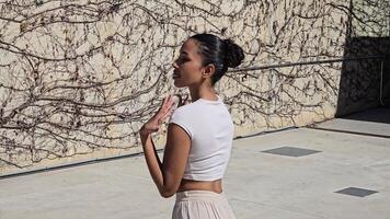 The graceful and mesmerizing movement of a talented dancer in an urban environment setting video