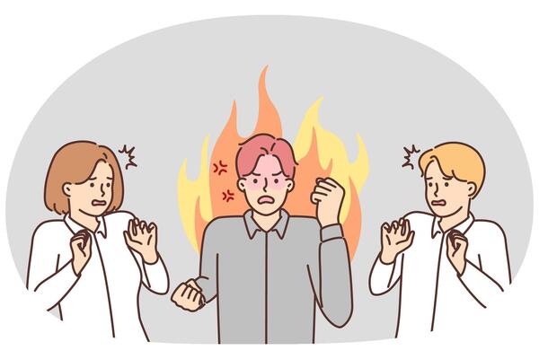 Angry man manager or office worker swears and waves hands scaring colleagues