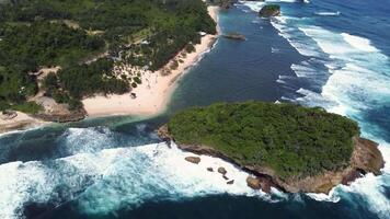 Drone Flyover Showing Small Island and Curved Shoreline, East Java, Indonesia video